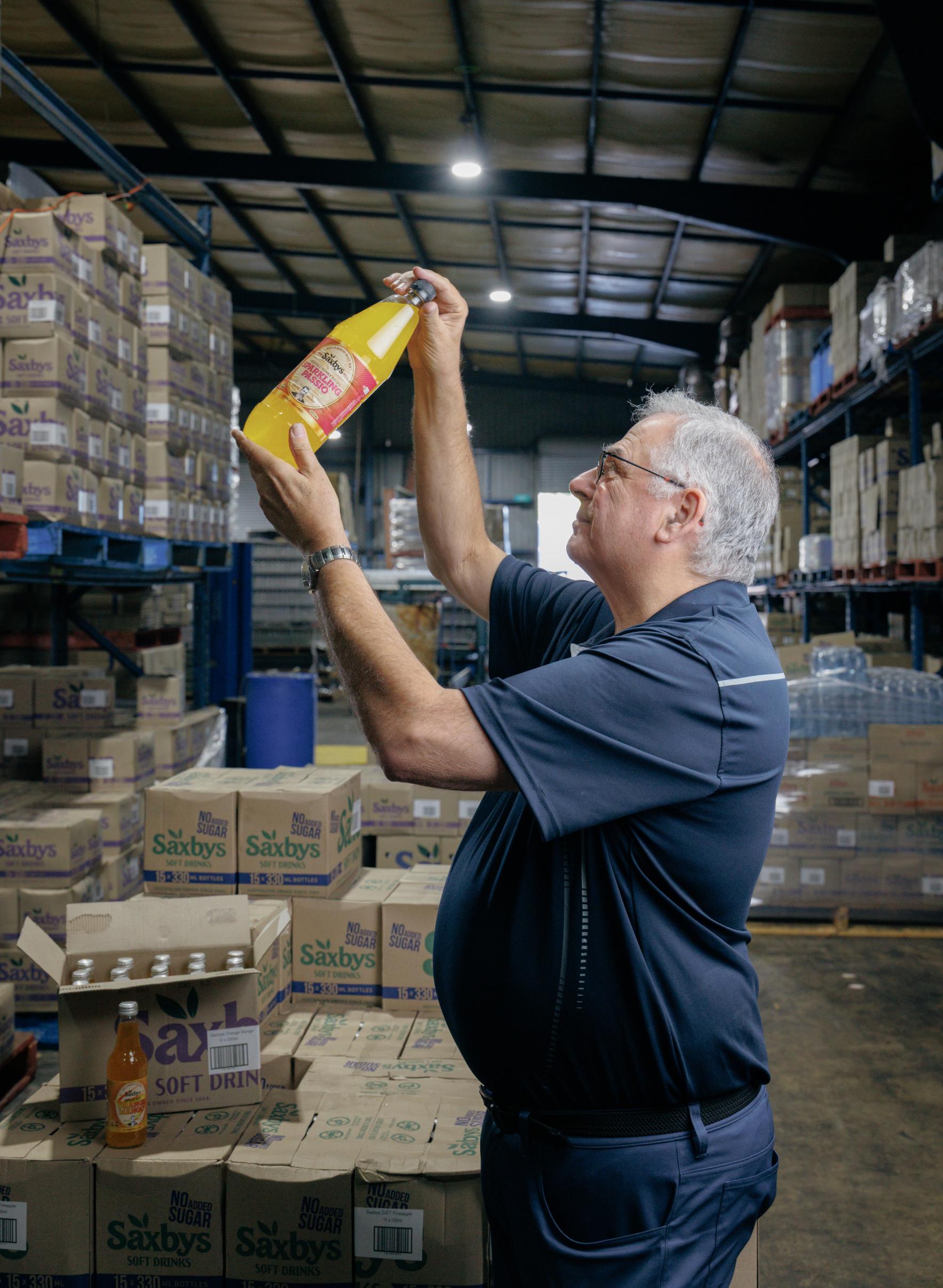 George Saxby inspecting at Saxbys Soft Drinks