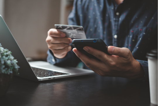 man on phone with credit card