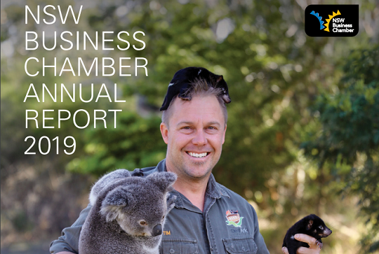 Man smiling holding a koala