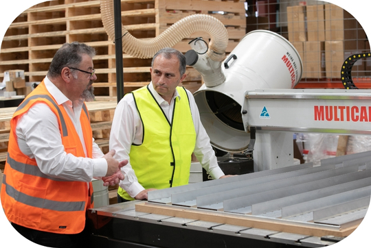 two men in high vis in warehouse